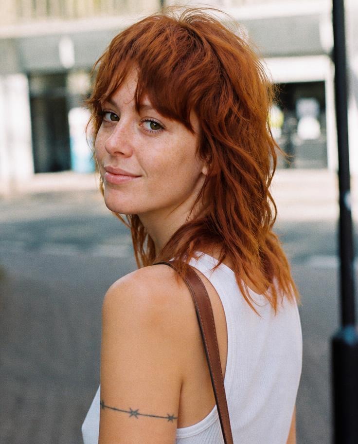 Model with a copper red shag haircut